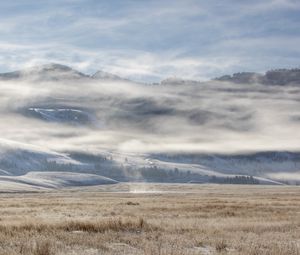 Preview wallpaper field, hills, clouds, snow, landscape