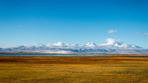Preview wallpaper field, lake, mountains, snow, clouds, landscape
