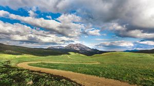 Preview wallpaper field, mountains, grass, clouds