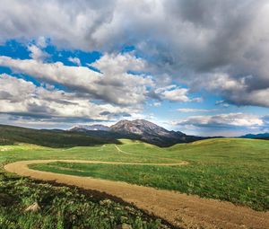 Preview wallpaper field, mountains, grass, clouds