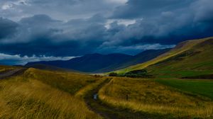 Preview wallpaper field, mountains, hills, clouds, landscape