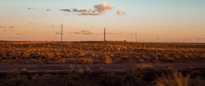 Preview wallpaper field, road, curb, journey, evening