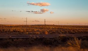 Preview wallpaper field, road, curb, journey, evening