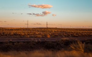 Preview wallpaper field, road, curb, journey, evening