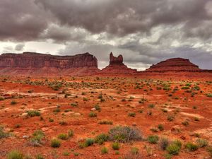 Preview wallpaper field, rocks, clouds, landscape