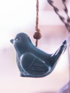 Preview wallpaper figure, bird, pendant