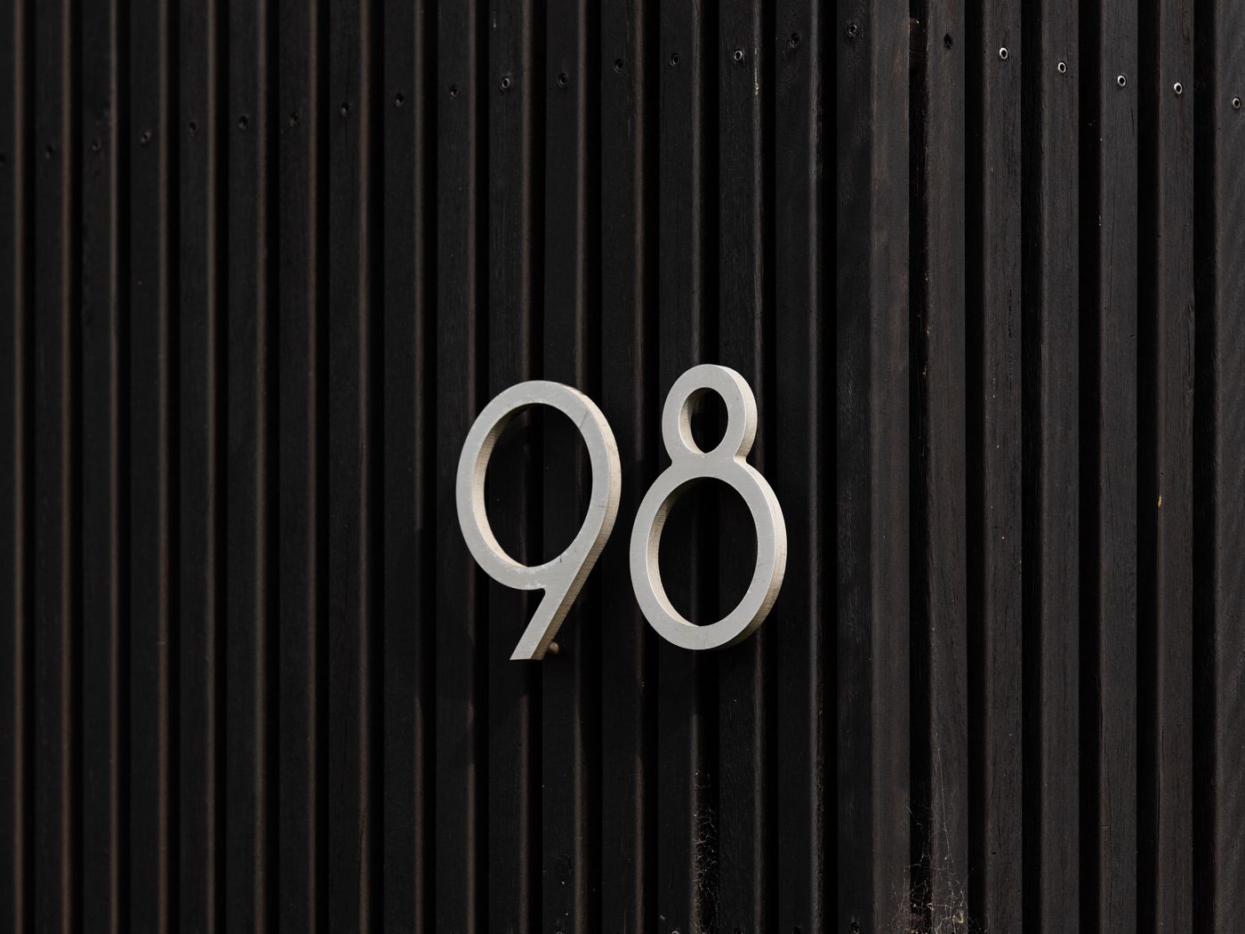 1400x1050 Wallpaper figure, fence, inscription, stripes