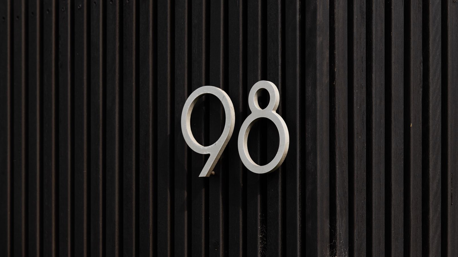 1600x900 Wallpaper figure, fence, inscription, stripes