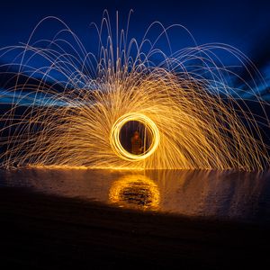 Preview wallpaper fire, circle, sparks, freezelight, dark