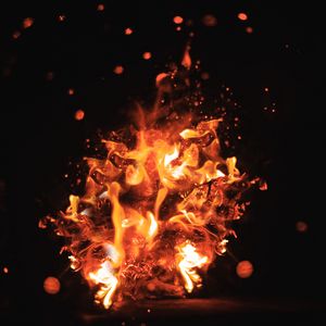 Preview wallpaper fire, sparks, dark, glare, bokeh