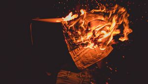 Preview wallpaper fire, sparks, newspaper, dark