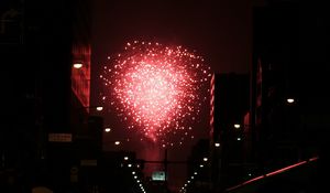 Preview wallpaper fireworks, pink, street, buildings, dark