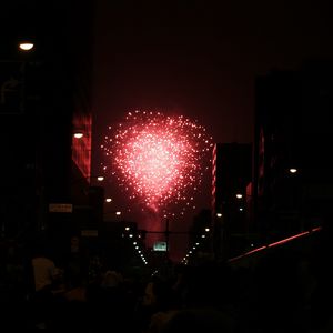 Preview wallpaper fireworks, pink, street, buildings, dark