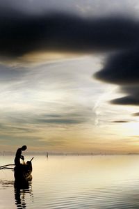 Preview wallpaper fisherman, lake, clouds, sky, boat