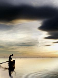 Preview wallpaper fisherman, lake, clouds, sky, boat