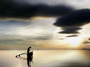 Preview wallpaper fisherman, lake, clouds, sky, boat