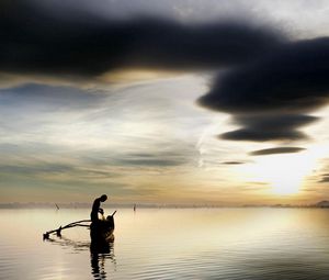 Preview wallpaper fisherman, lake, clouds, sky, boat