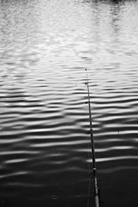 Preview wallpaper fishing rod, water, fishing, ripples, minimalism, black and white
