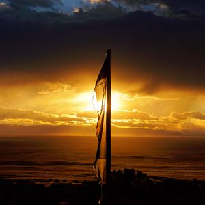 Preview wallpaper flagpole, hose, sky, sunset, dark