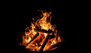 Preview wallpaper flame, bonfire, fire, sparks, dark