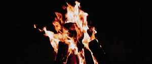 Preview wallpaper flame, bonfire, sparks, fire, black, dark