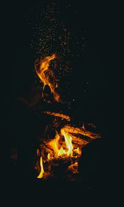 Preview wallpaper flame, sparks, dark, bonfire