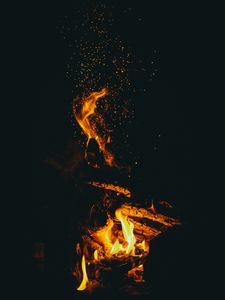 Preview wallpaper flame, sparks, dark, bonfire