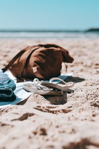 Preview wallpaper flip-flops, briefcase, beach, sand