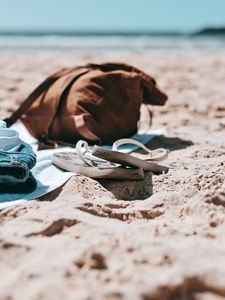 Preview wallpaper flip-flops, briefcase, beach, sand