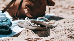 Preview wallpaper flip-flops, briefcase, beach, sand