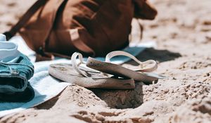 Preview wallpaper flip-flops, briefcase, beach, sand