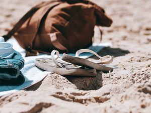 Preview wallpaper flip-flops, briefcase, beach, sand