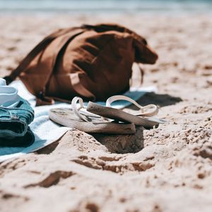 Preview wallpaper flip-flops, briefcase, beach, sand