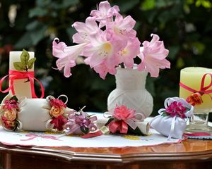Preview wallpaper flowers, vase, roses, bags, bows, candles, table
