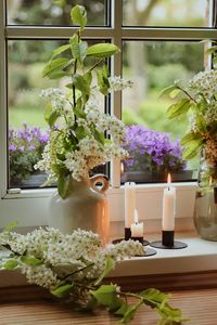 Preview wallpaper flowers, vases, candles, window, light