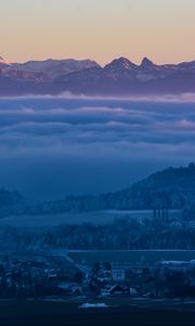 Preview wallpaper fog, mountains, twilight, winter, sky, switzerland