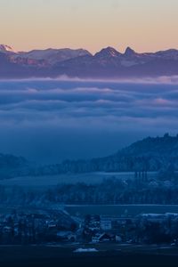 Preview wallpaper fog, mountains, twilight, winter, sky, switzerland