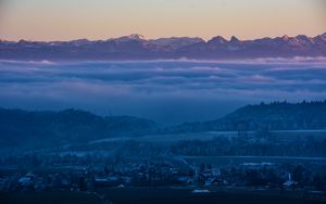 Preview wallpaper fog, mountains, twilight, winter, sky, switzerland