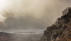 Preview wallpaper fog, rock, cliff, stone