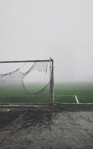 Preview wallpaper football gate, torn, fog, lawn, mood, gloomy