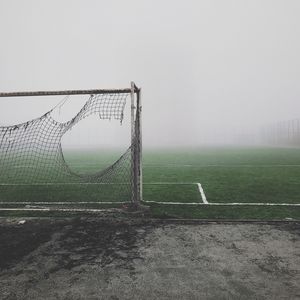Preview wallpaper football gate, torn, fog, lawn, mood, gloomy