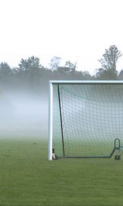 Preview wallpaper football goal, field, football, fog, trees, haze