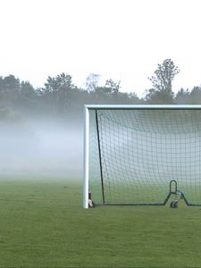 Preview wallpaper football goal, field, football, fog, trees, haze