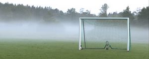 Preview wallpaper football goal, field, football, fog, trees, haze