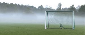 Preview wallpaper football goal, field, football, fog, trees, haze