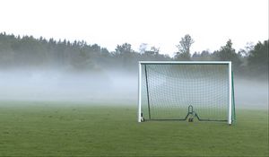 Preview wallpaper football goal, field, football, fog, trees, haze