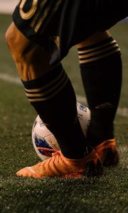 Preview wallpaper footballer, ball, football boots, lawn, half-hose