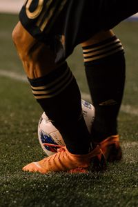 Preview wallpaper footballer, ball, football boots, lawn, half-hose