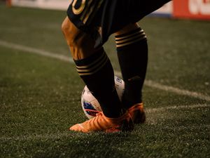 Preview wallpaper footballer, ball, football boots, lawn, half-hose