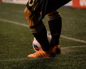 Preview wallpaper footballer, ball, football boots, lawn, half-hose